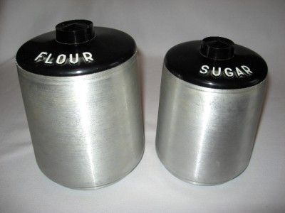   SPUN ALUMINUM 8 PIECE CANISTER SET WITH SALT AND PEPPER SHAKERS  
